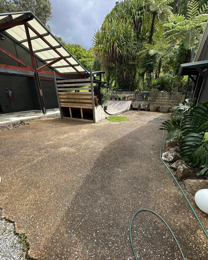 Outdoor concrete area before professional pressure cleaning