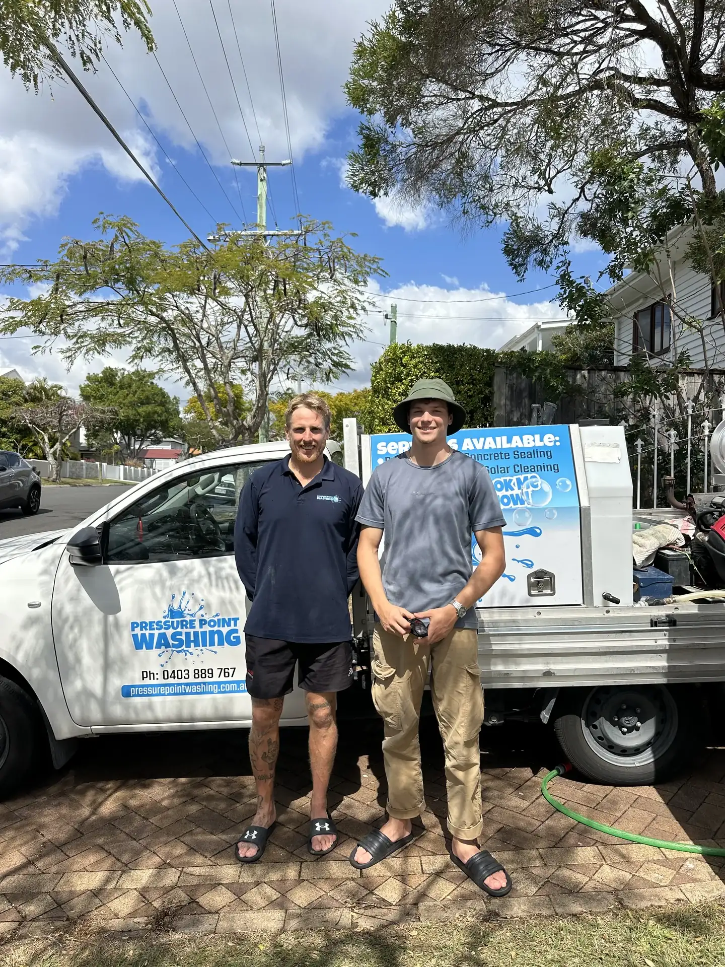 REEF Pressure Cleaning team beside their exterior cleaning vehicle on the Gold Coast